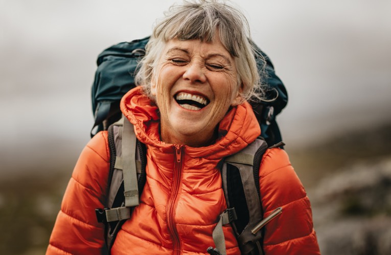 Woman hiking and laughing